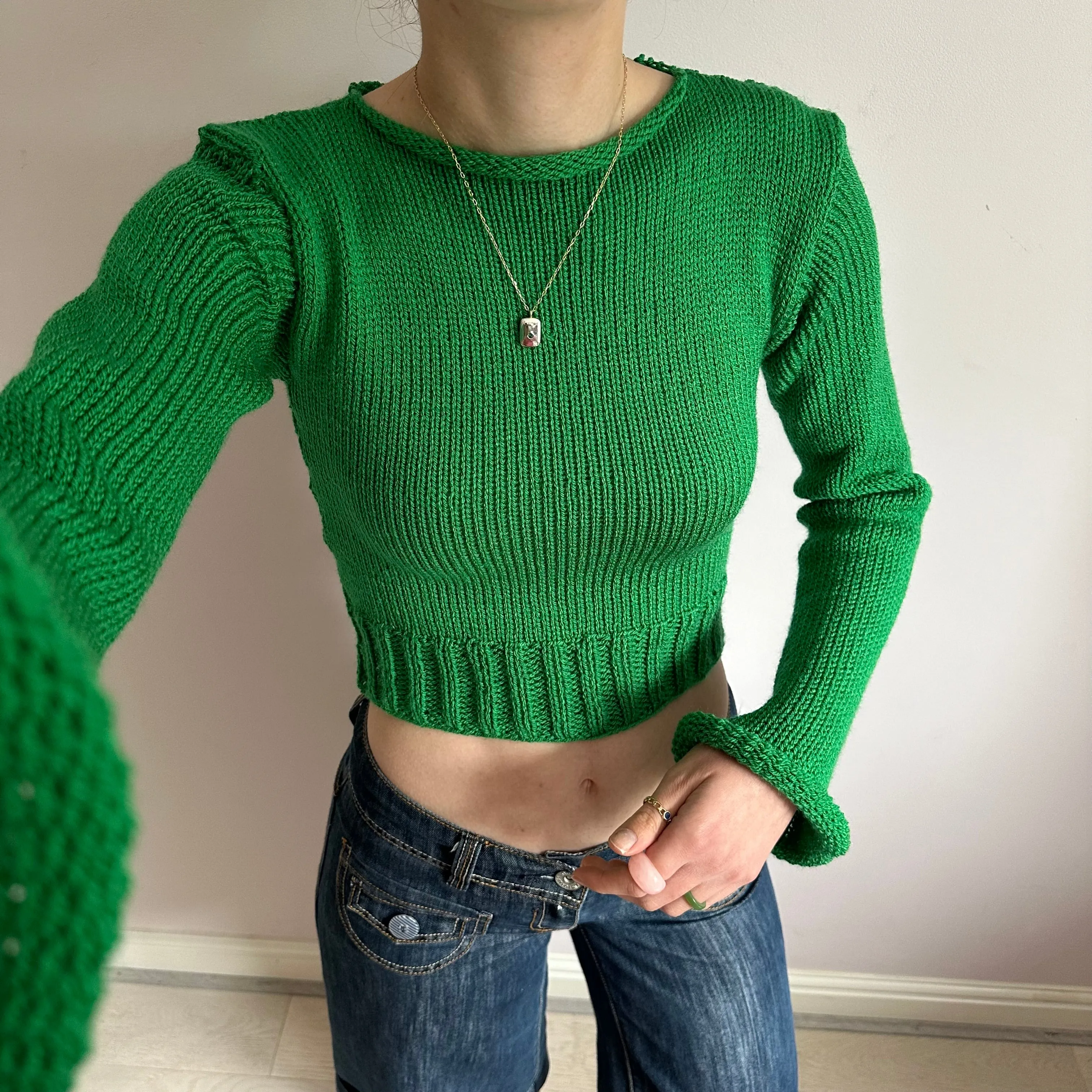 Handmade green ribbed knit jumper with flared sleeves