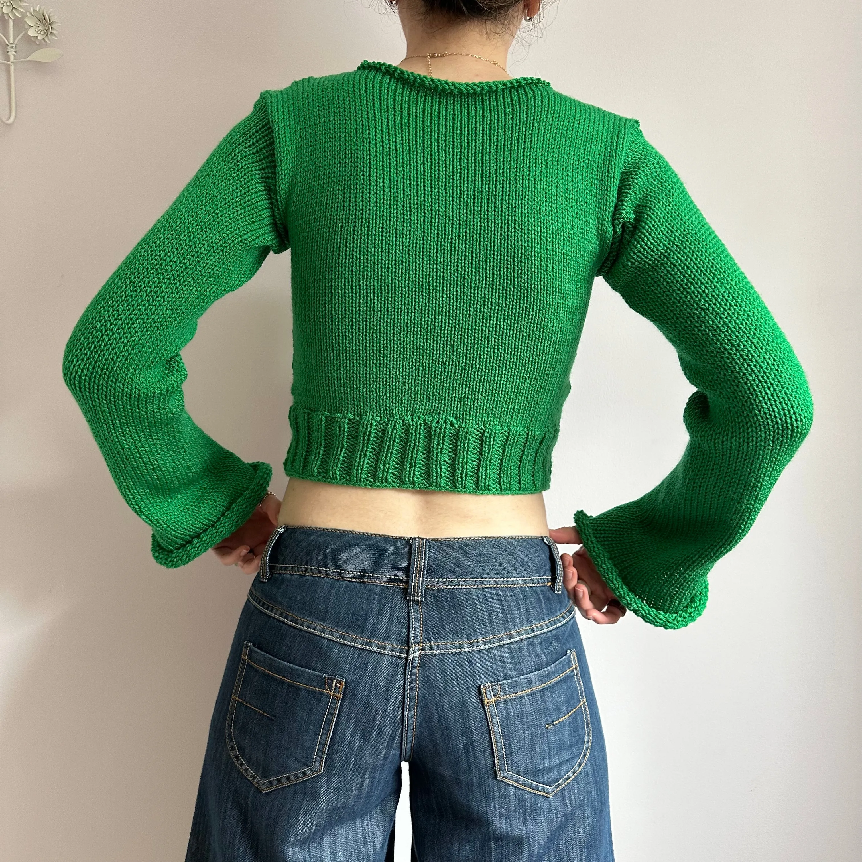 Handmade green ribbed knit jumper with flared sleeves