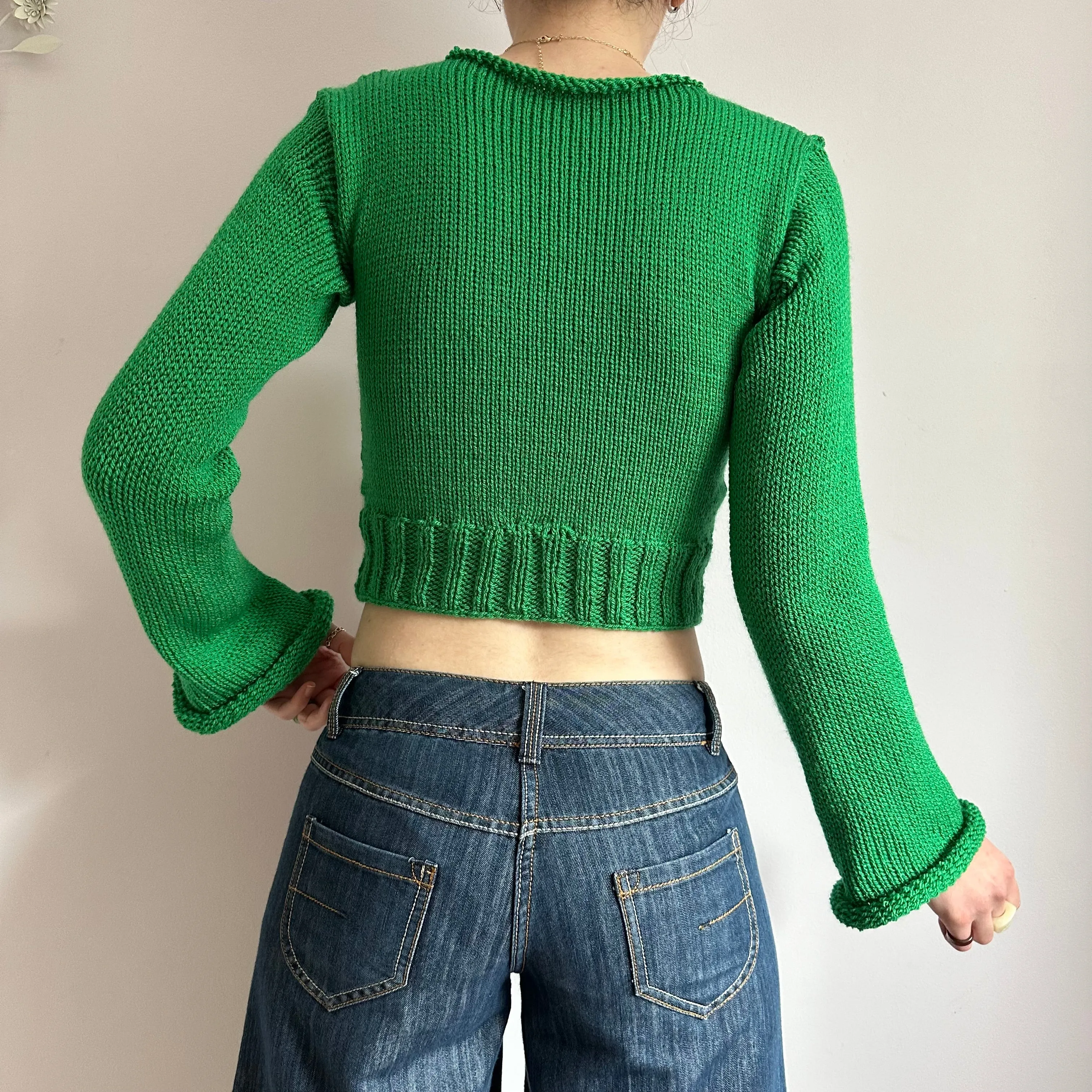 Handmade green ribbed knit jumper with flared sleeves
