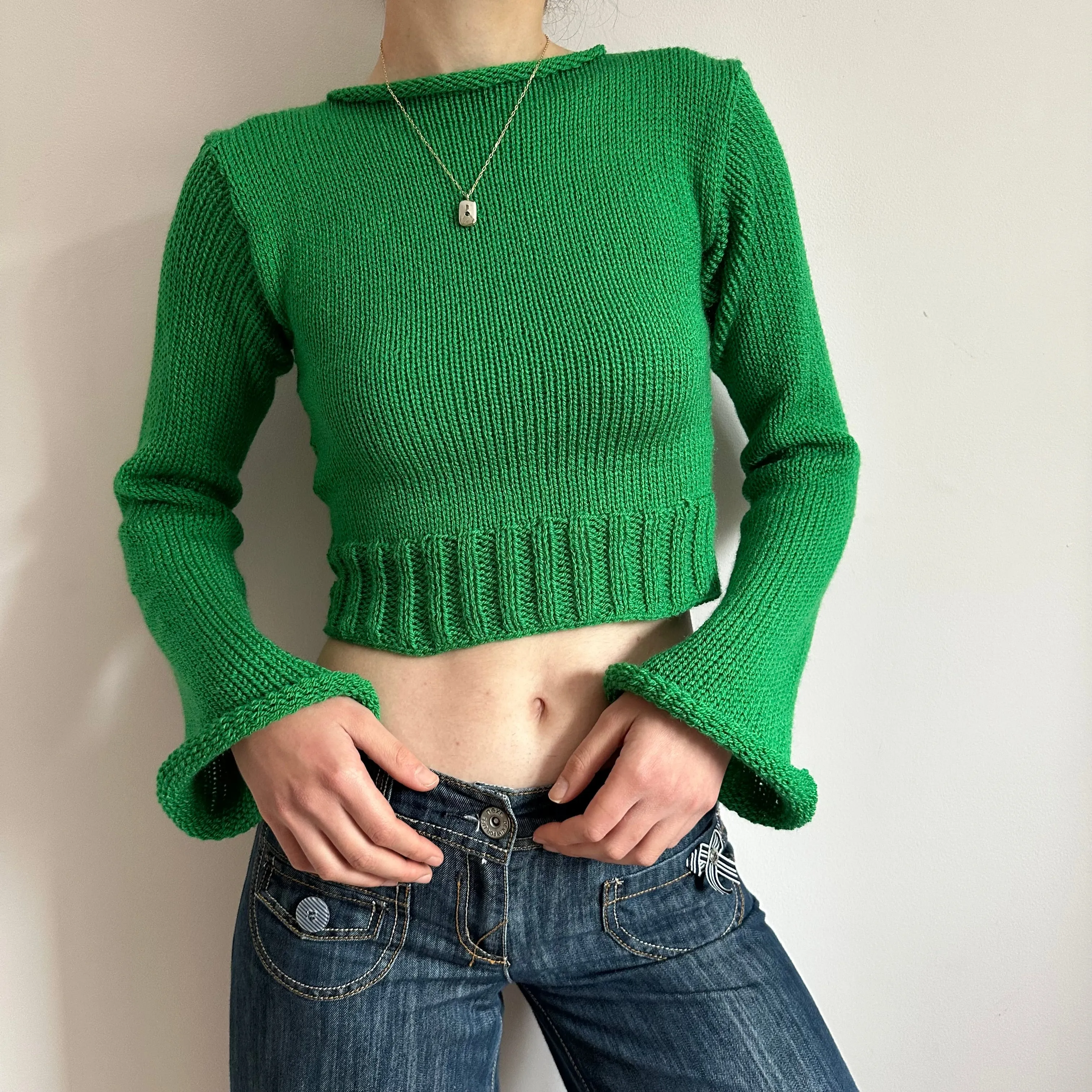 Handmade green ribbed knit jumper with flared sleeves