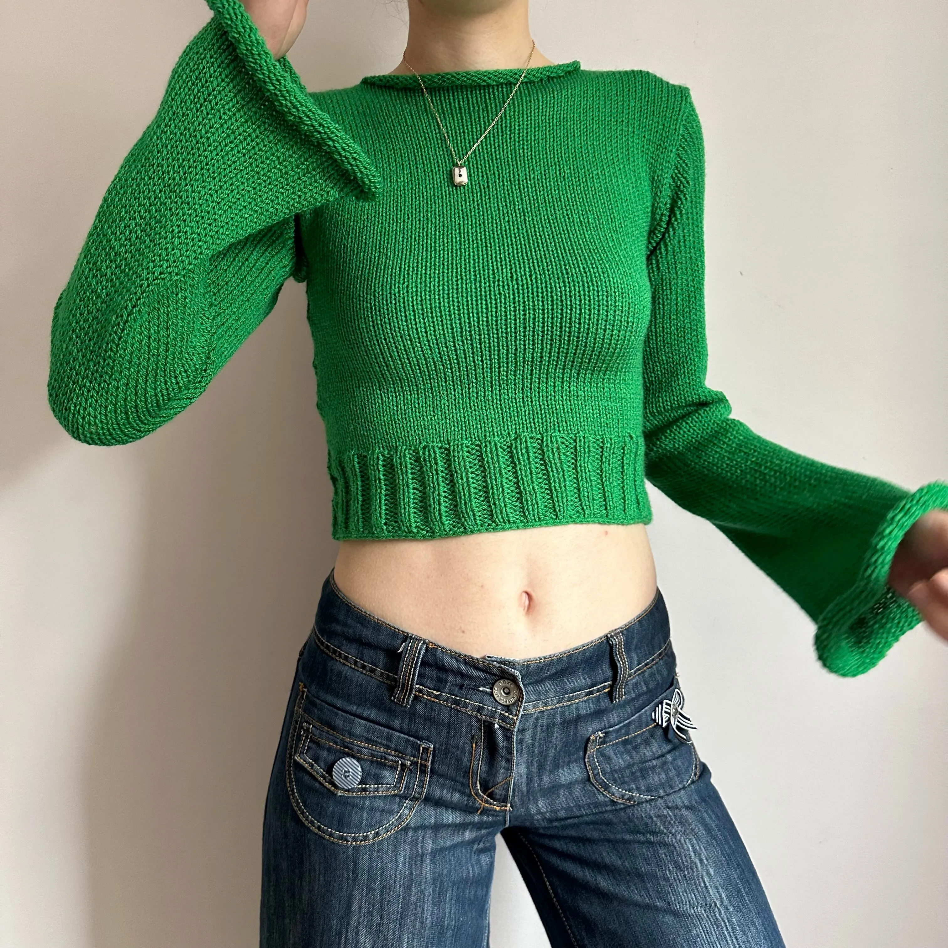 Handmade green ribbed knit jumper with flared sleeves