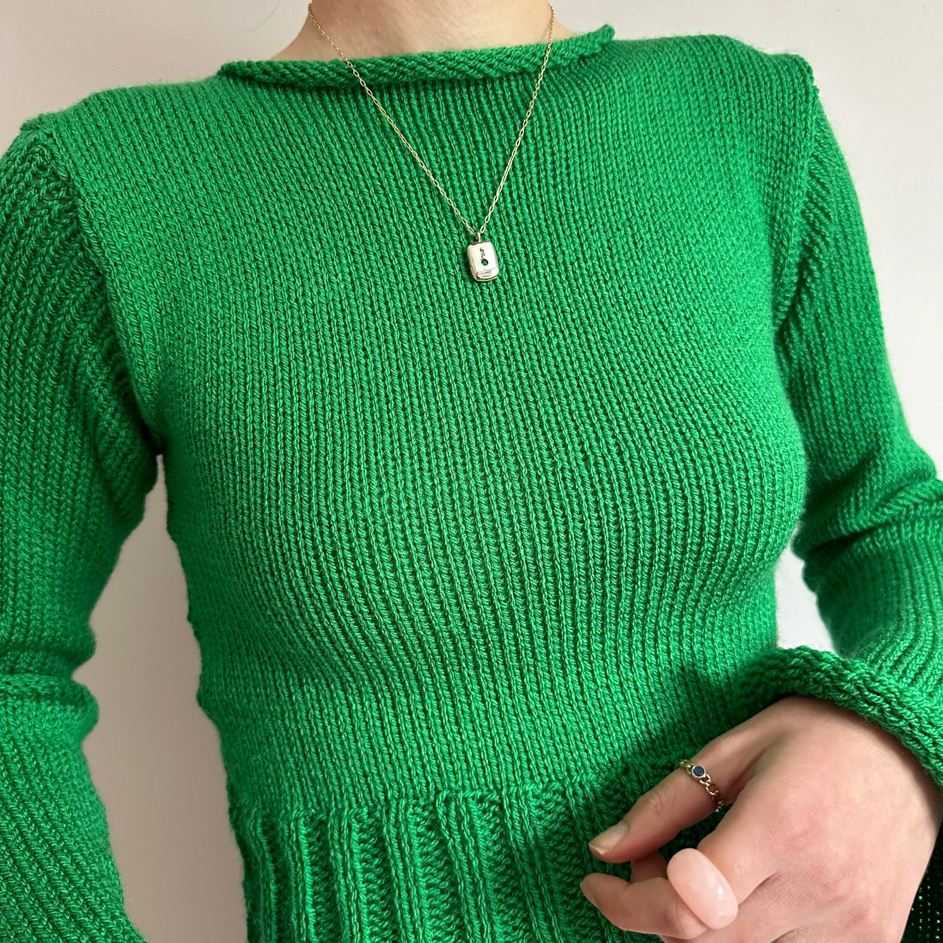 Handmade green ribbed knit jumper with flared sleeves