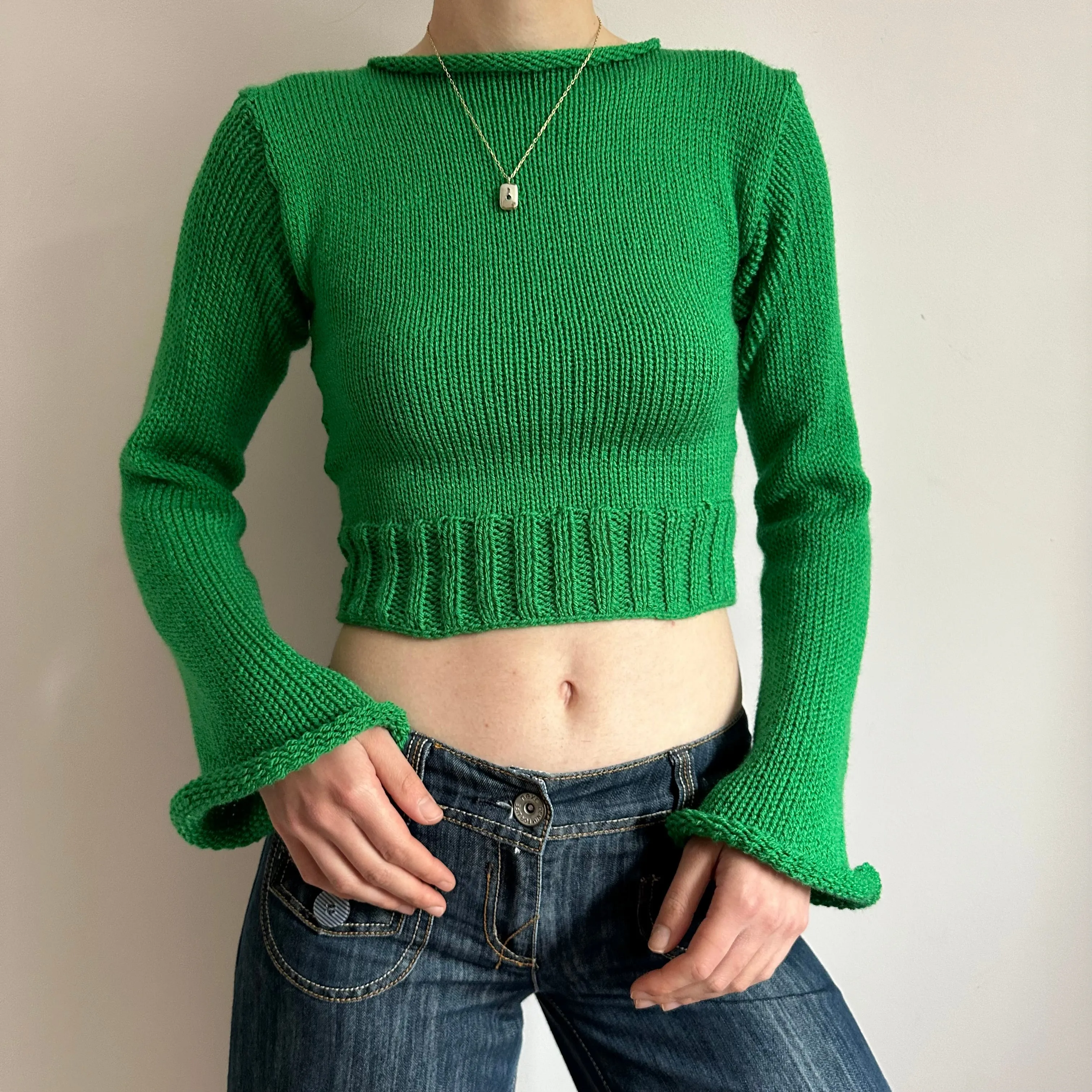Handmade green ribbed knit jumper with flared sleeves